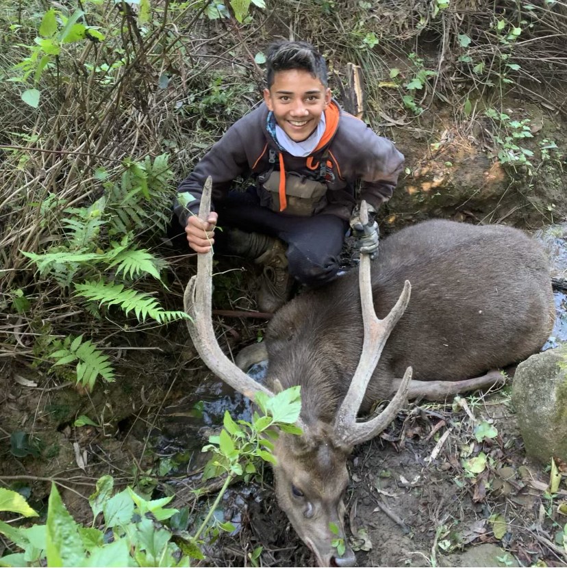dadoog with a deer harvest in the bush