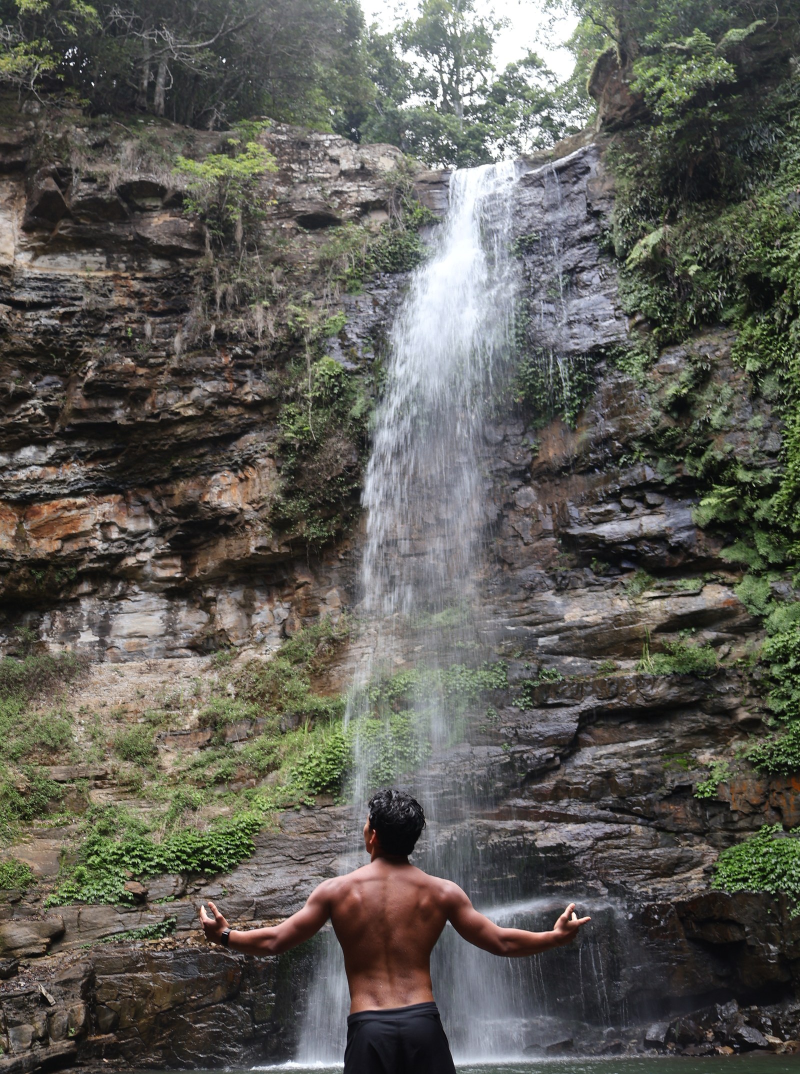 dadoog under a waterfall